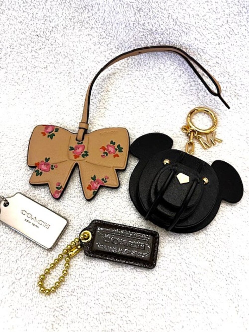 3 Coach and 1 Michael Kors bag charm/key chain set of 4 pieces